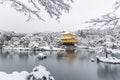 Temple Kinkakuji Golden Pavilion with snow fall